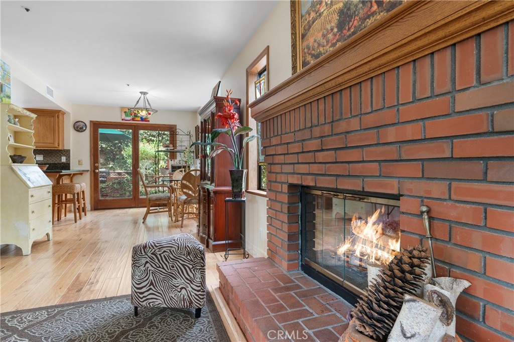 333 Genoa Street, Unit 6 Arcadia, CA 91006 - Photo 6 of 40 a living room with furniture a chandelier and a fireplace