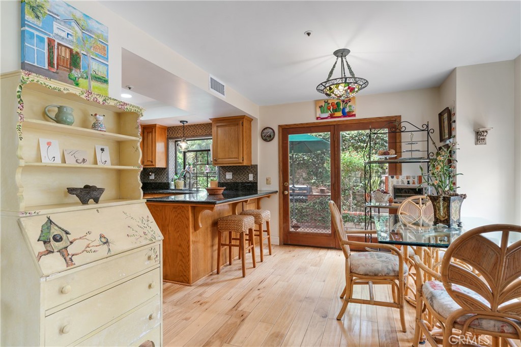 333 Genoa Street, Unit 6 Arcadia, CA 91006 - Photo 7 of 40 a view of a dining room with furniture large windows and wooden floor