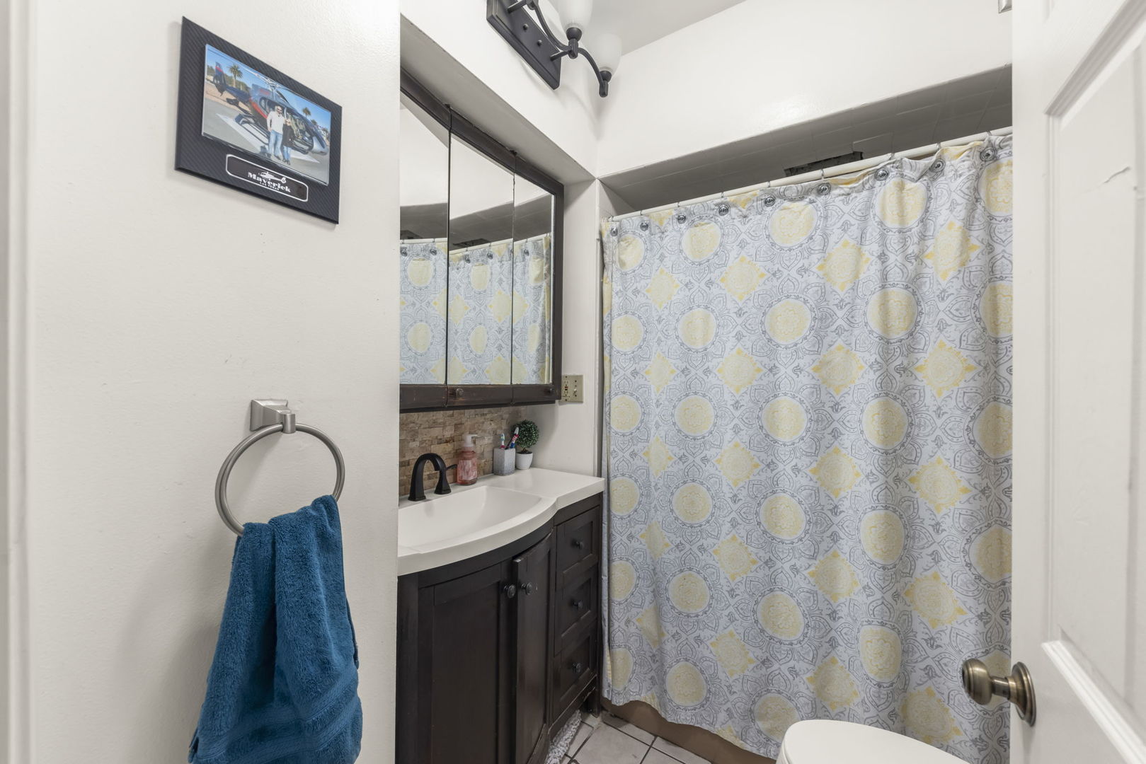 8440 Joliet Road McCook, IL 60525 - Photo 11 of 36 a bathroom with a sink mirror and a toilet
