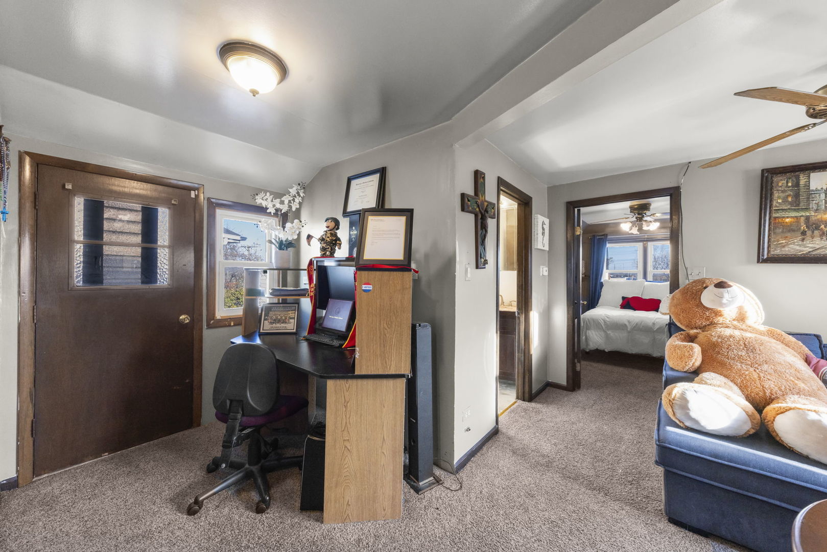 8440 Joliet Road McCook, IL 60525 - Photo 13 of 36 a view of a livingroom with workspace and a window