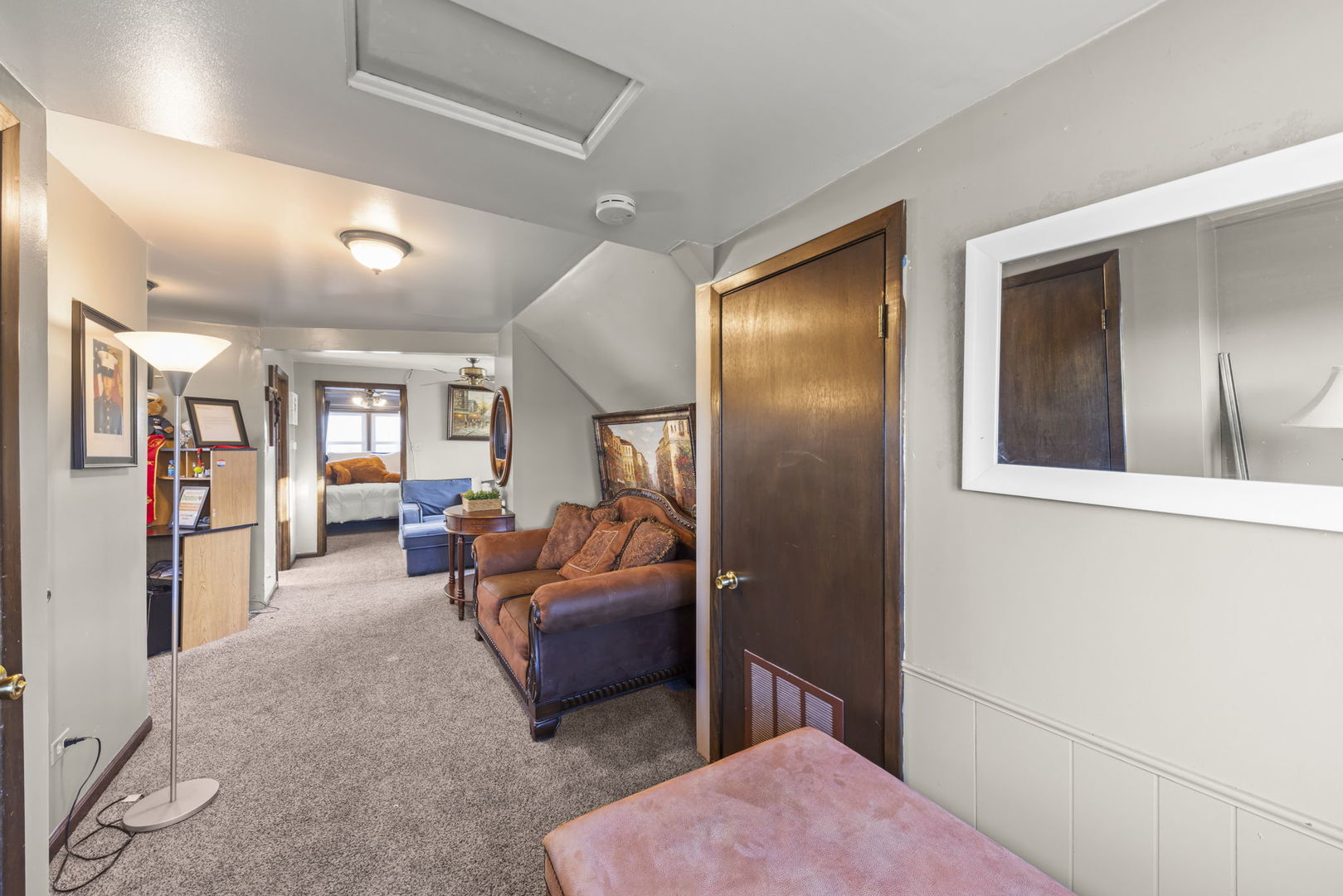 8440 Joliet Road McCook, IL 60525 - Photo 15 of 36 a bedroom with furniture and wooden floor