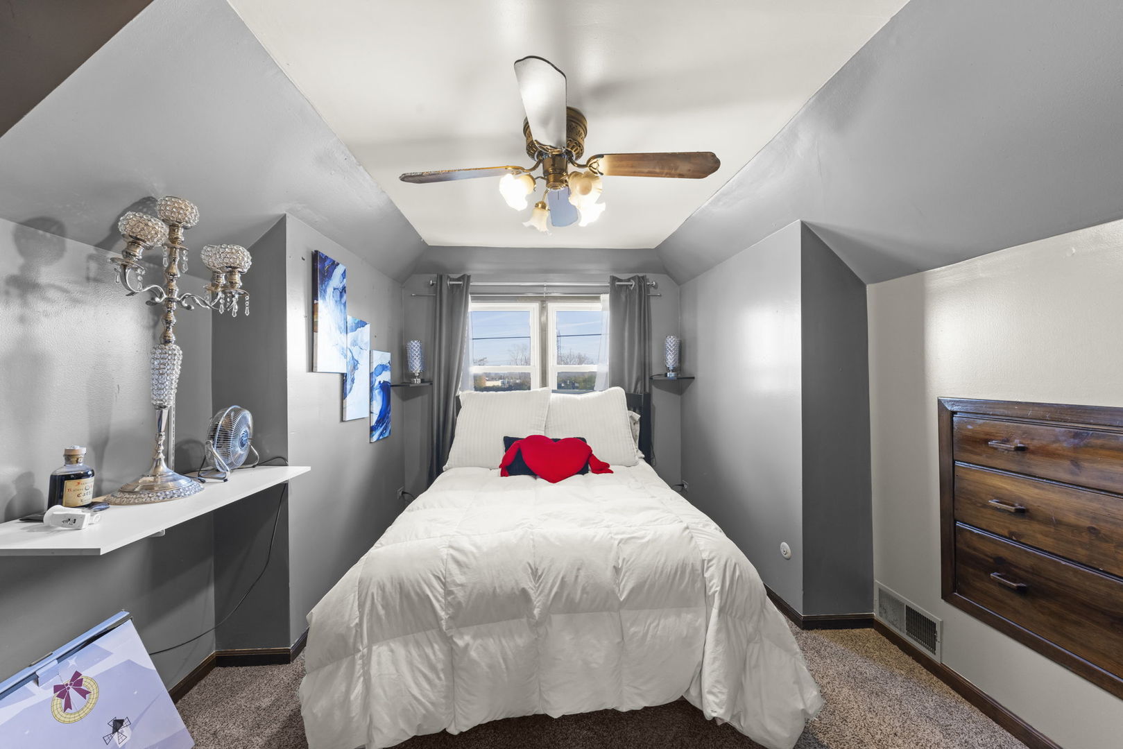 8440 Joliet Road McCook, IL 60525 - Photo 16 of 36 a bedroom with a bed and a chandelier