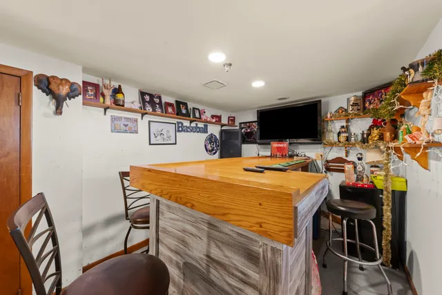 a room with furniture and a flat screen tv