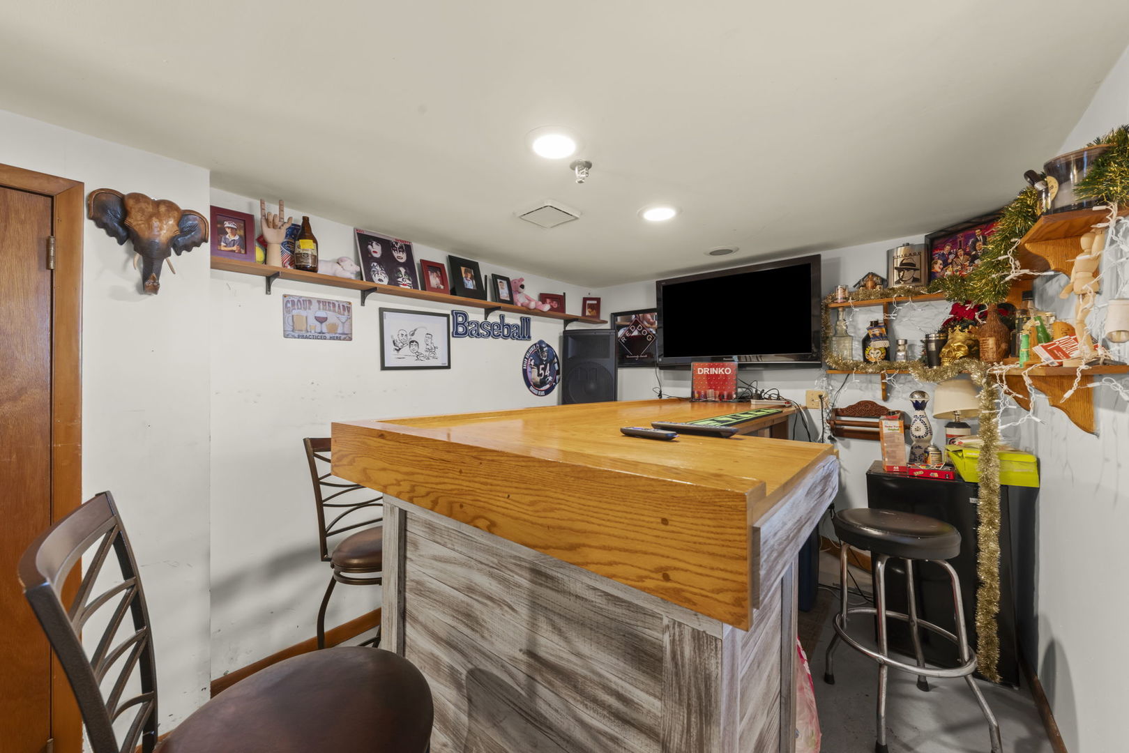 8440 Joliet Road McCook, IL 60525 - Photo 19 of 36 a room with furniture and a flat screen tv