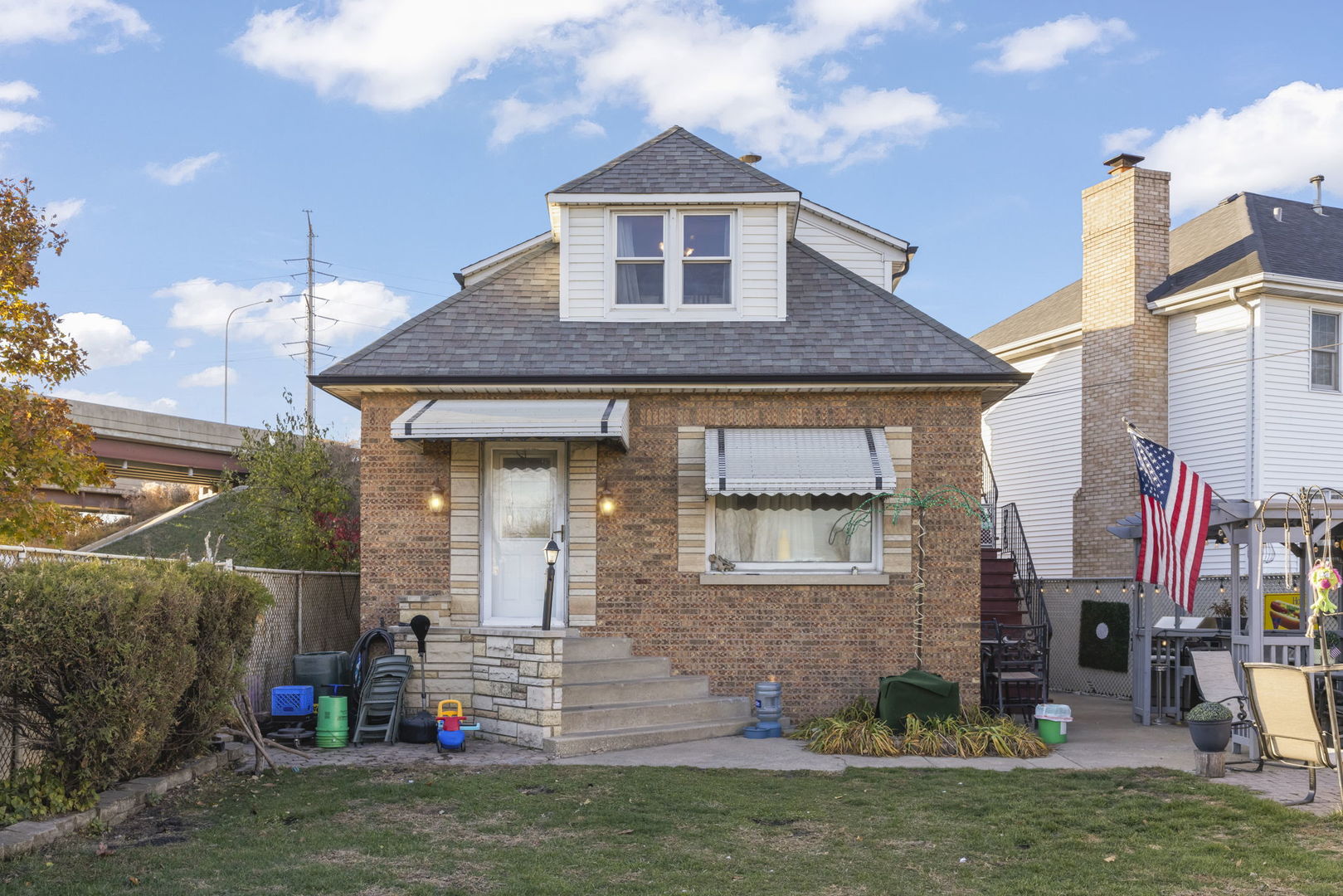 8440 Joliet Road McCook, IL 60525 - Photo 23 of 36 a front view of a house with a yard