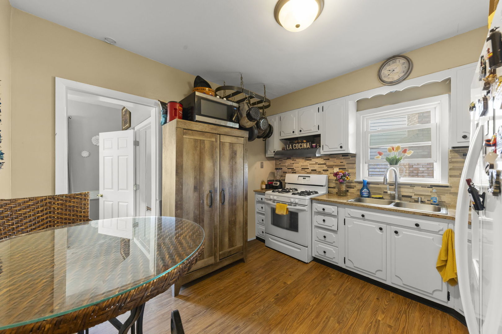 8440 Joliet Road McCook, IL 60525 - Photo 3 of 36 a kitchen with granite countertop a sink stove and refrigerator