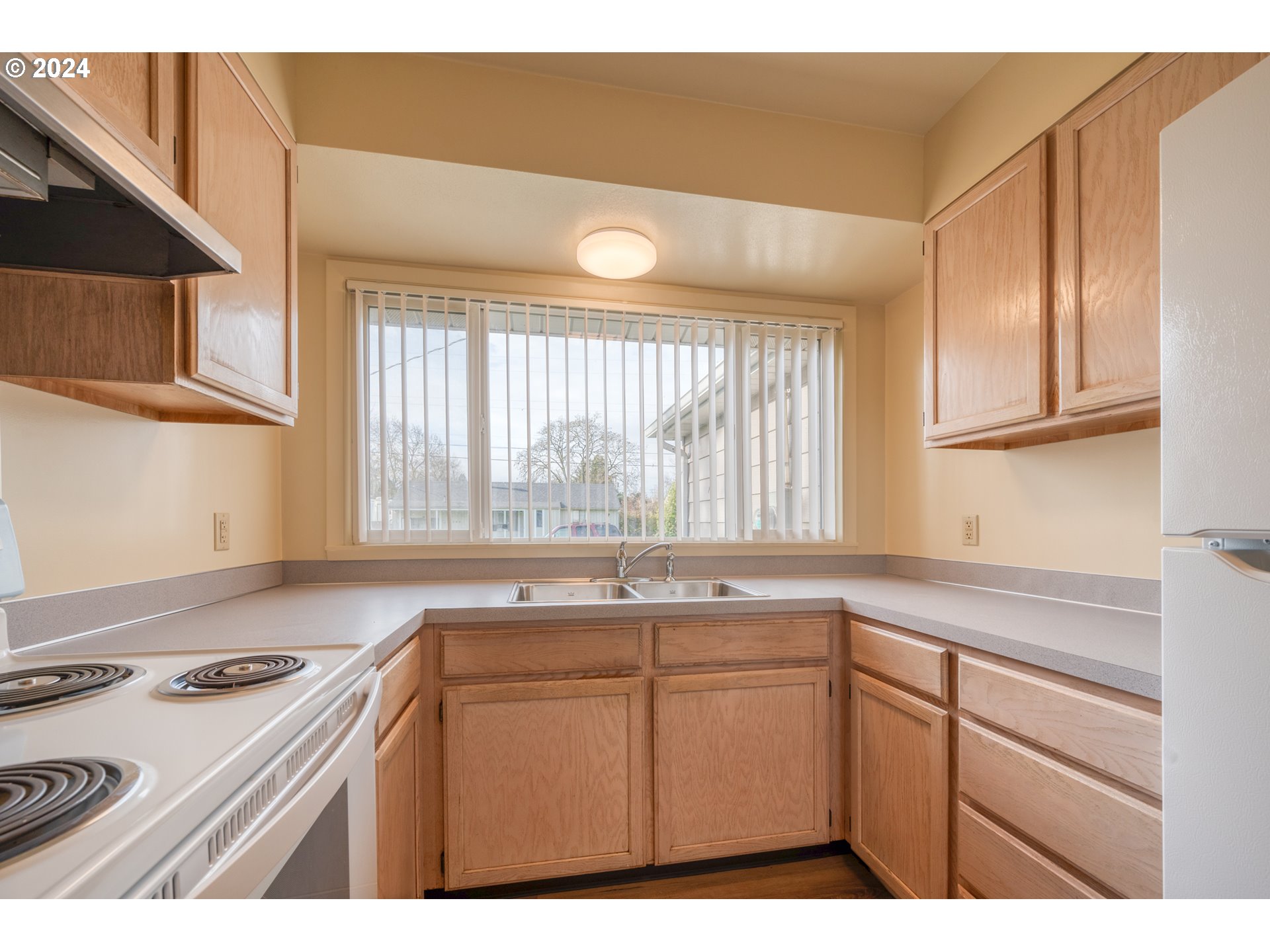 541 Waite Street Eugene, OR 97402 - Photo 11 of 25 a kitchen with a sink stove and cabinets