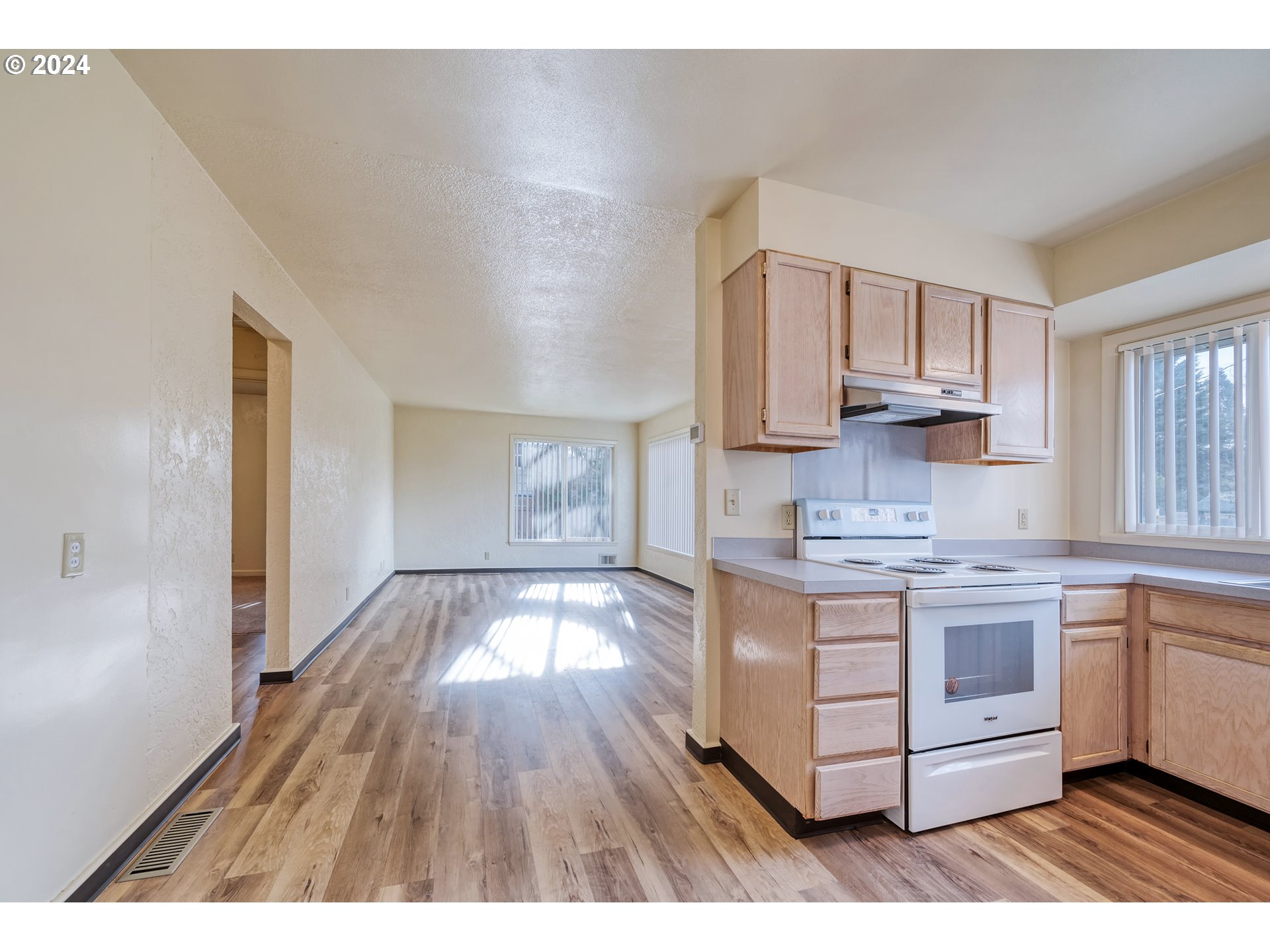 541 Waite Street Eugene, OR 97402 - Photo 8 of 25 a kitchen with stainless steel appliances granite countertop a stove and a sink