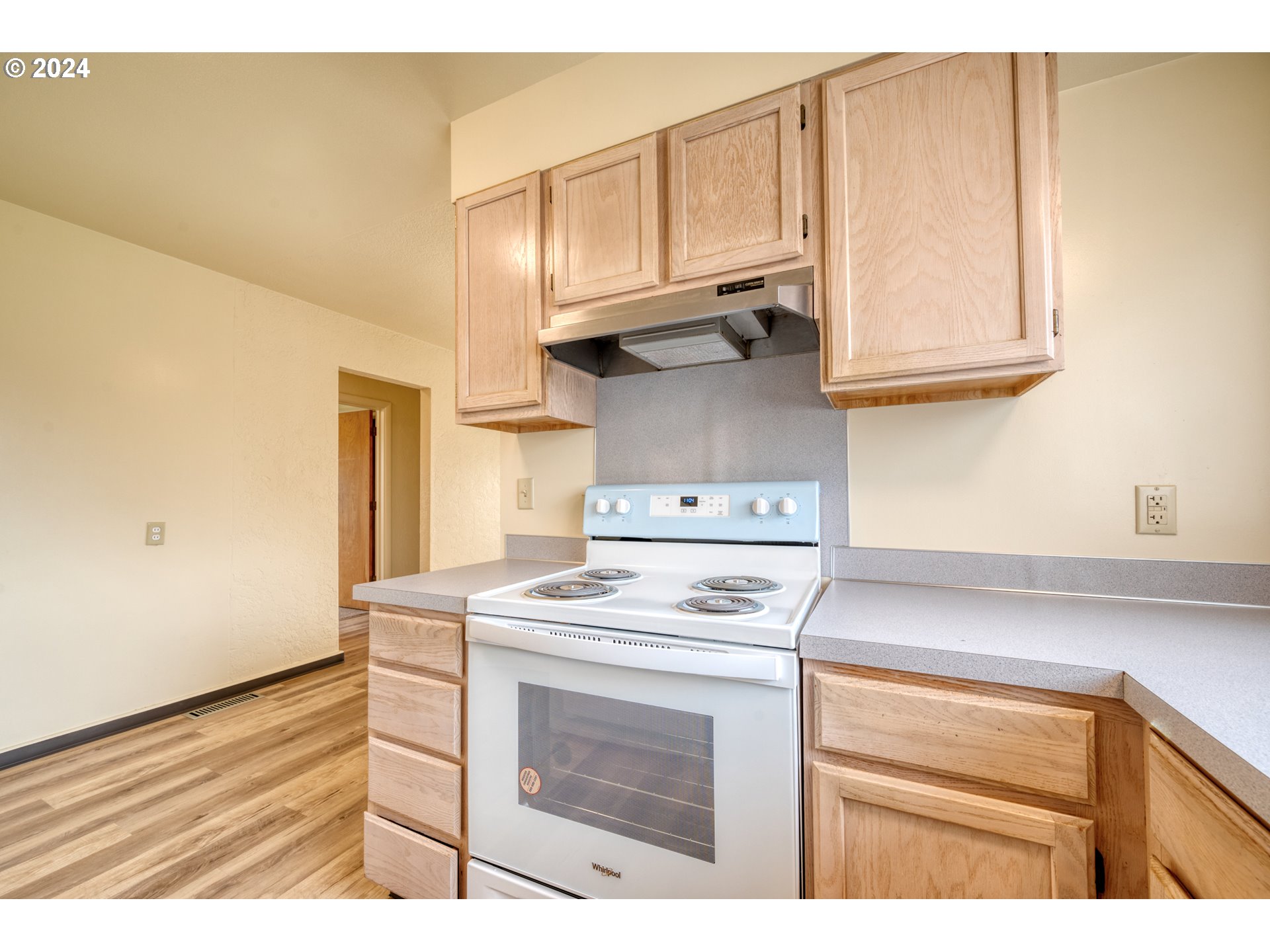 541 Waite Street Eugene, OR 97402 - Photo 9 of 25 a kitchen with stainless steel appliances granite countertop a stove a sink and a microwave