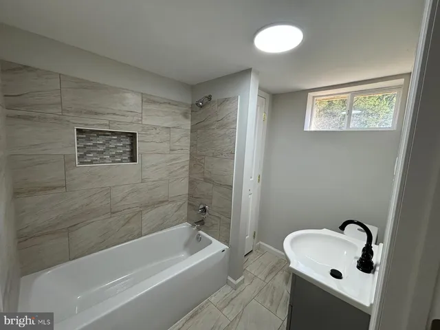a bathroom with a sink and a bathtub