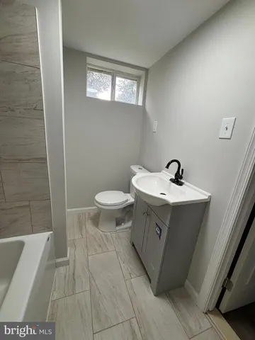 a bathroom with a sink and a toilet