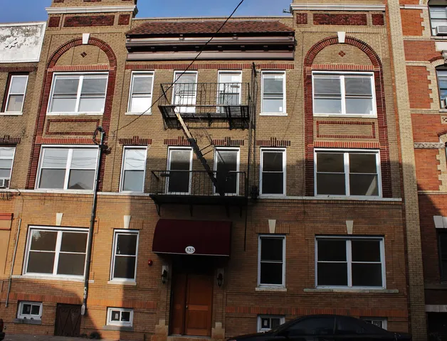 a front view of a multi story residential apartment building