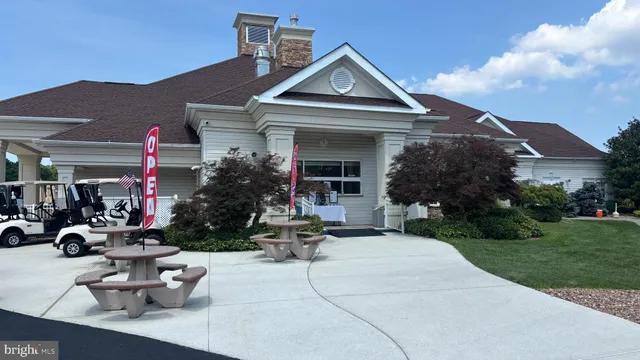 a view of a house with sitting area and garden