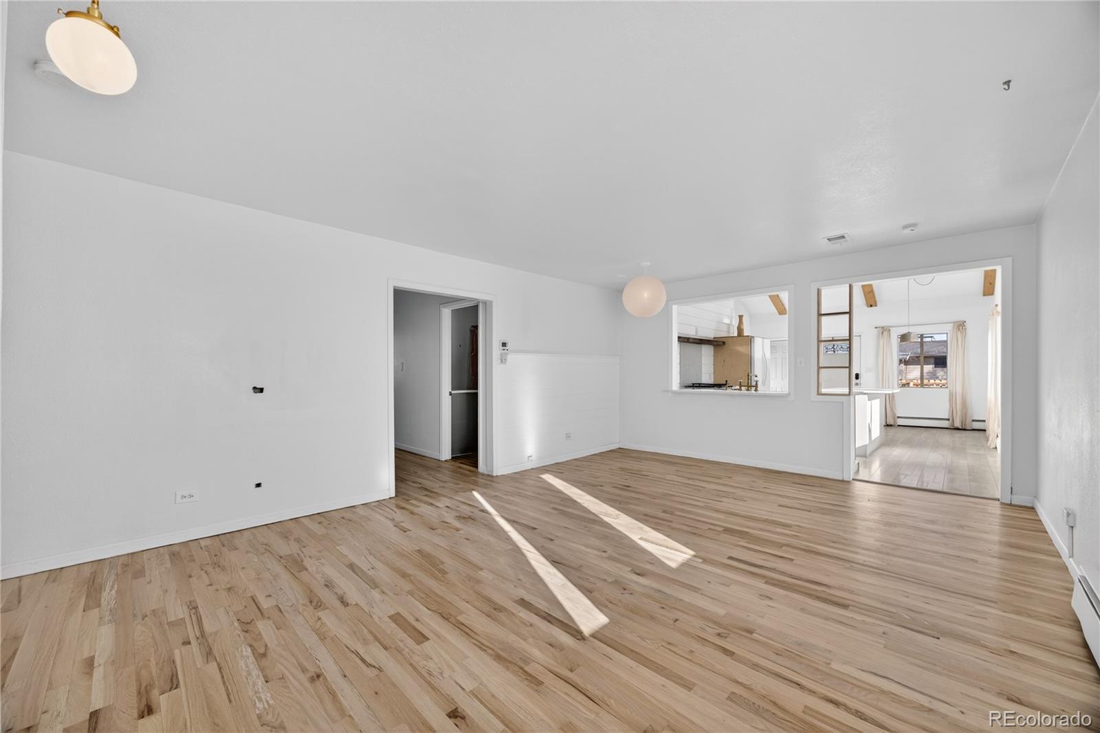 2375 Hanover Street Aurora, CO 80010 - Photo 14 of 36 a view of empty room with wooden floor