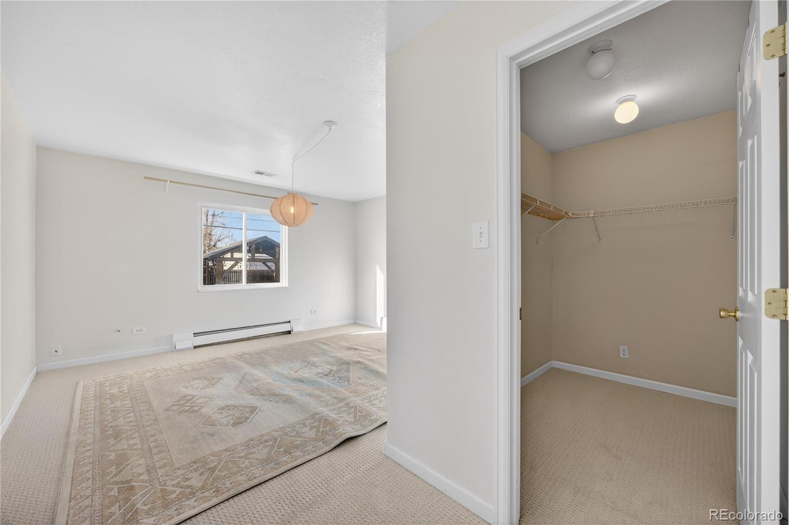 2375 Hanover Street Aurora, CO 80010 - Photo 18 of 36 an empty room with windows and closet