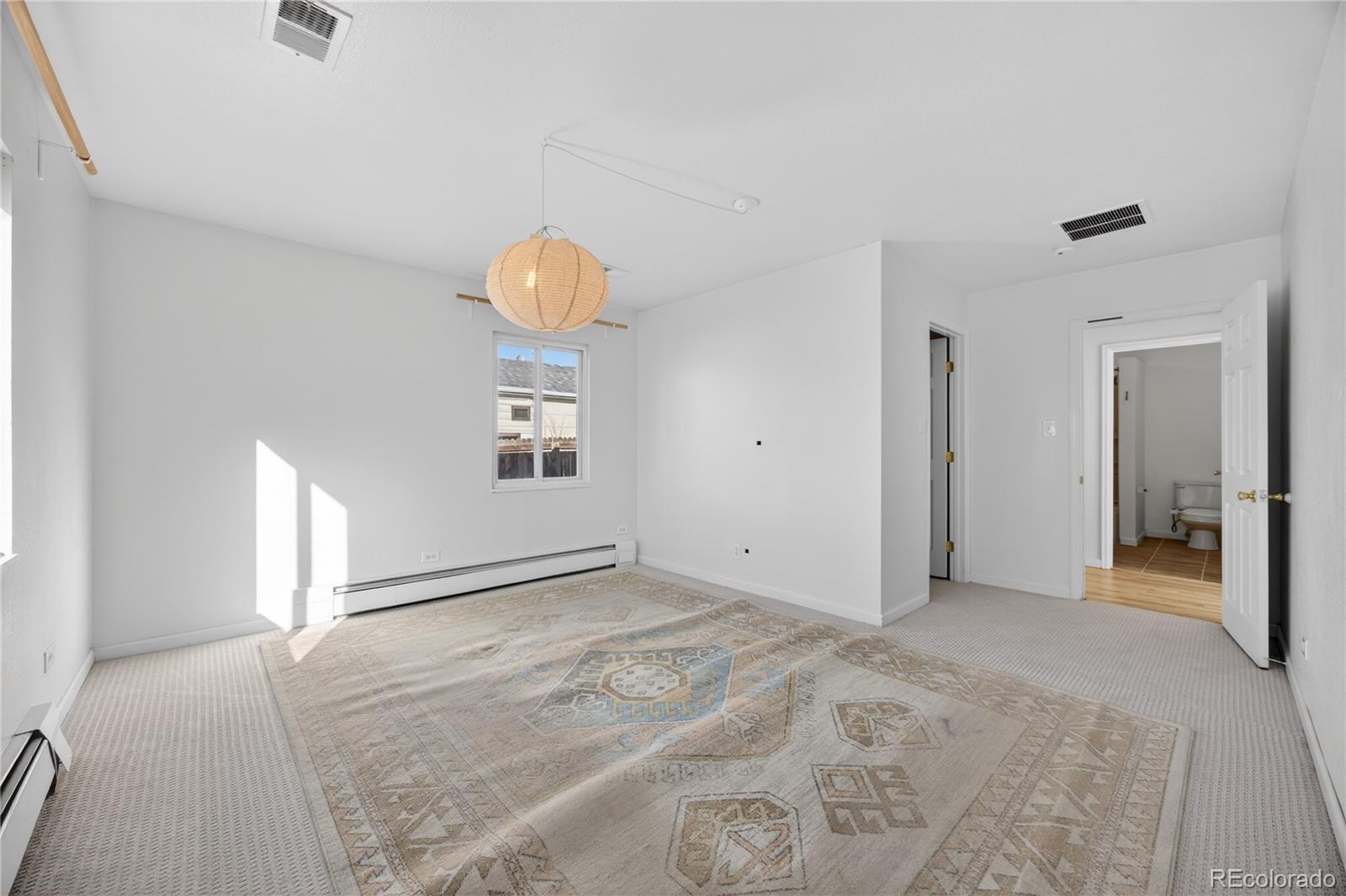 2375 Hanover Street Aurora, CO 80010 - Photo 19 of 36 a view of a livingroom with wooden floor and window