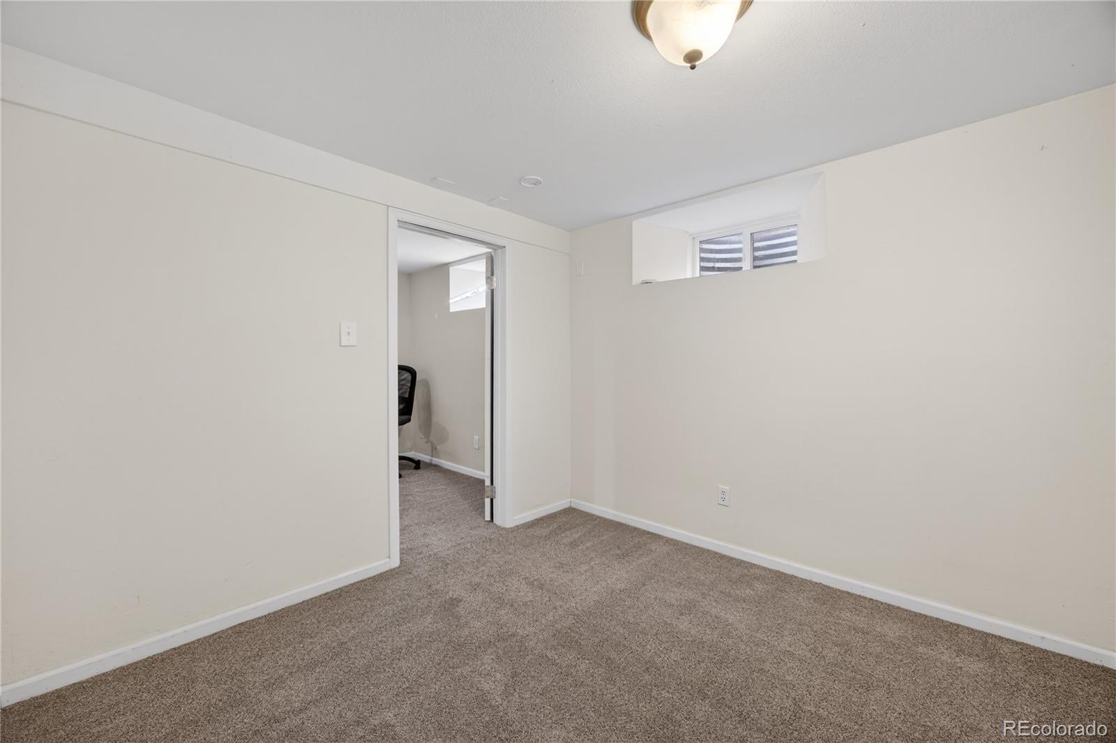 2375 Hanover Street Aurora, CO 80010 - Photo 22 of 36 a view of a room with window