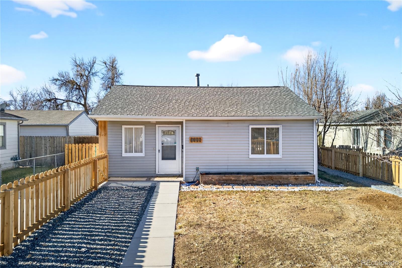 2375 Hanover Street Aurora, CO 80010 - Photo 35 of 36 a front view of a house with a yard