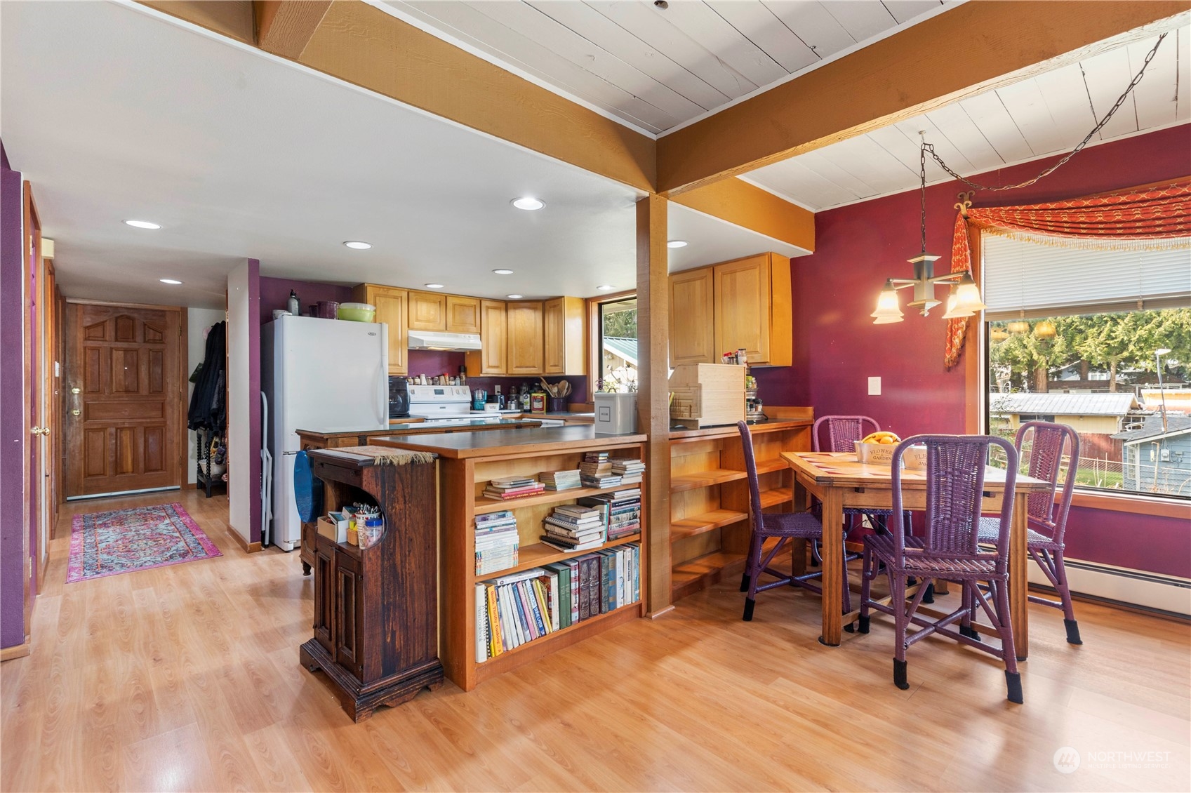 5523 Lerch Road Snohomish, WA 98290 - Photo 7 of 32 a kitchen with stainless steel appliances kitchen island granite countertop a table chairs and a refrigerator