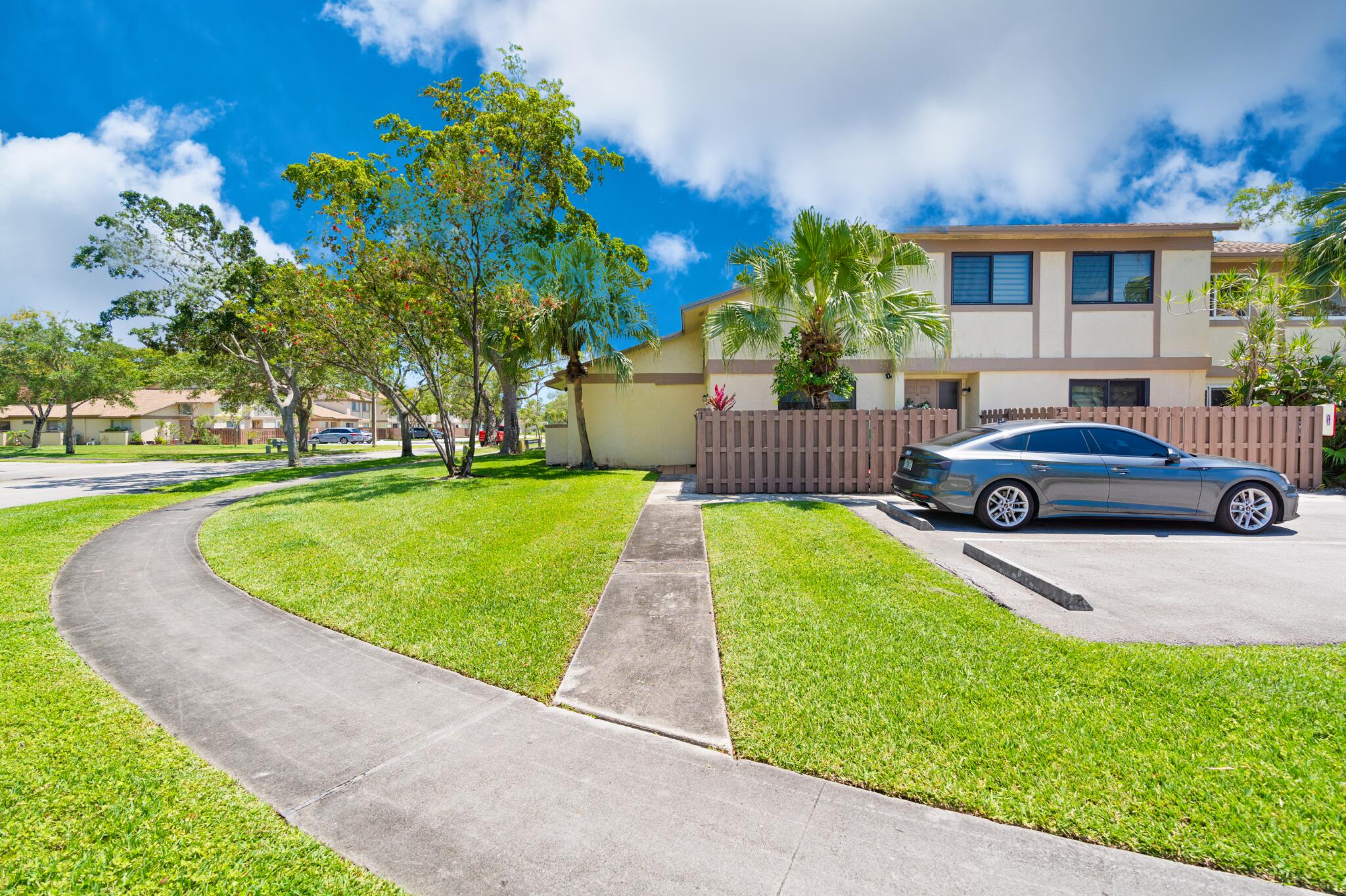 10650 Northwest 30th Place, Unit 1 Sunrise, FL 33322 - Photo 2 of 38 a house view with a garden space