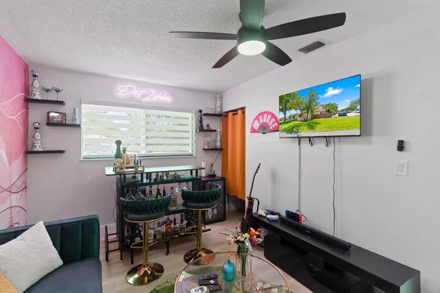 a room with furniture and a flat screen tv