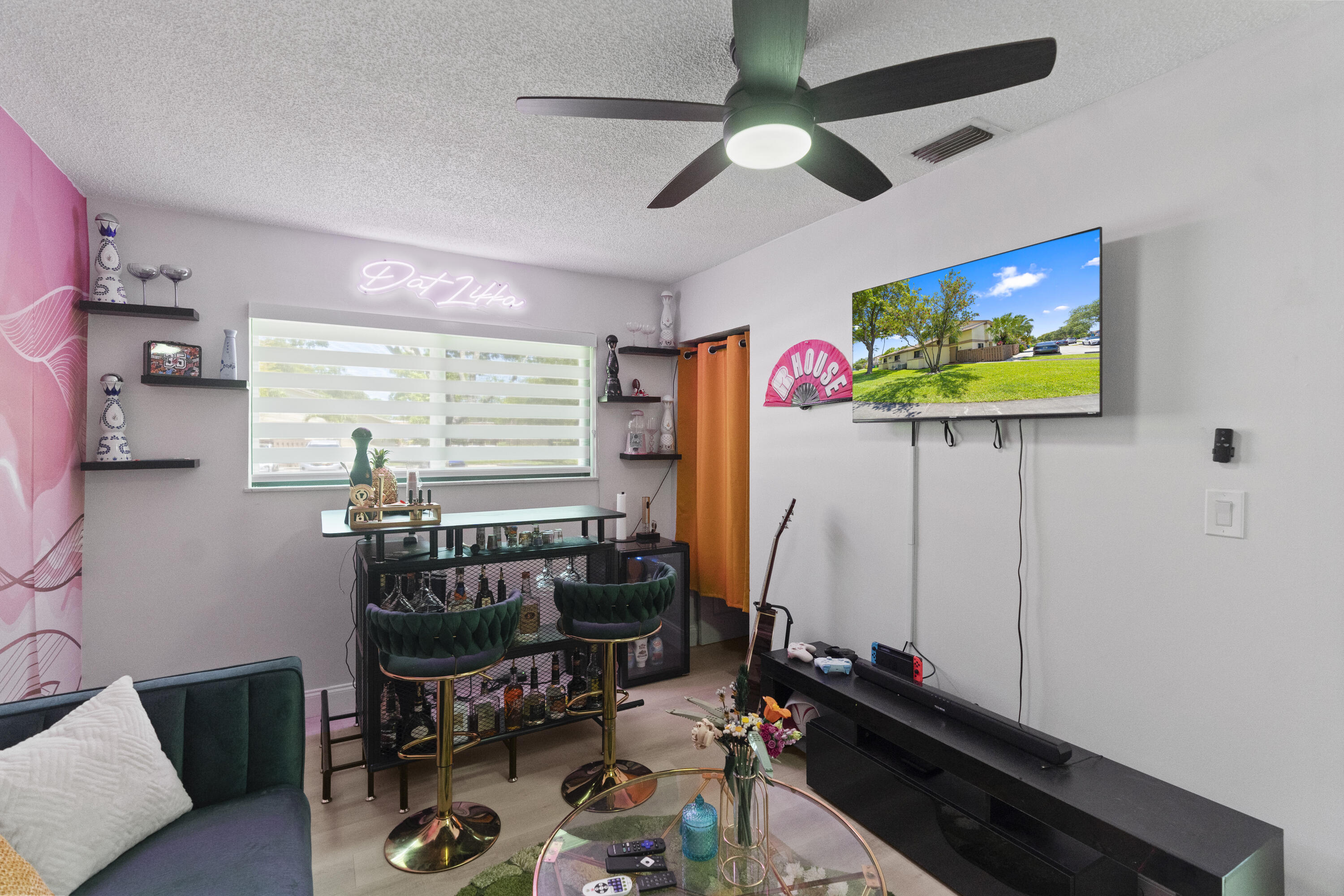 10650 Northwest 30th Place, Unit 1 Sunrise, FL 33322 - Photo 21 of 38 a room with furniture and a flat screen tv
