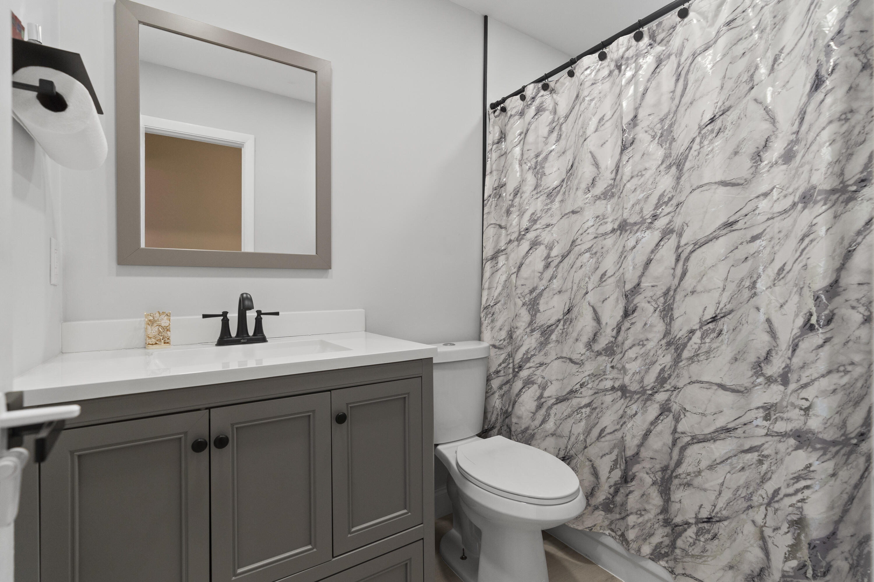 10650 Northwest 30th Place, Unit 1 Sunrise, FL 33322 - Photo 24 of 38 a bathroom with a sink and a toilet