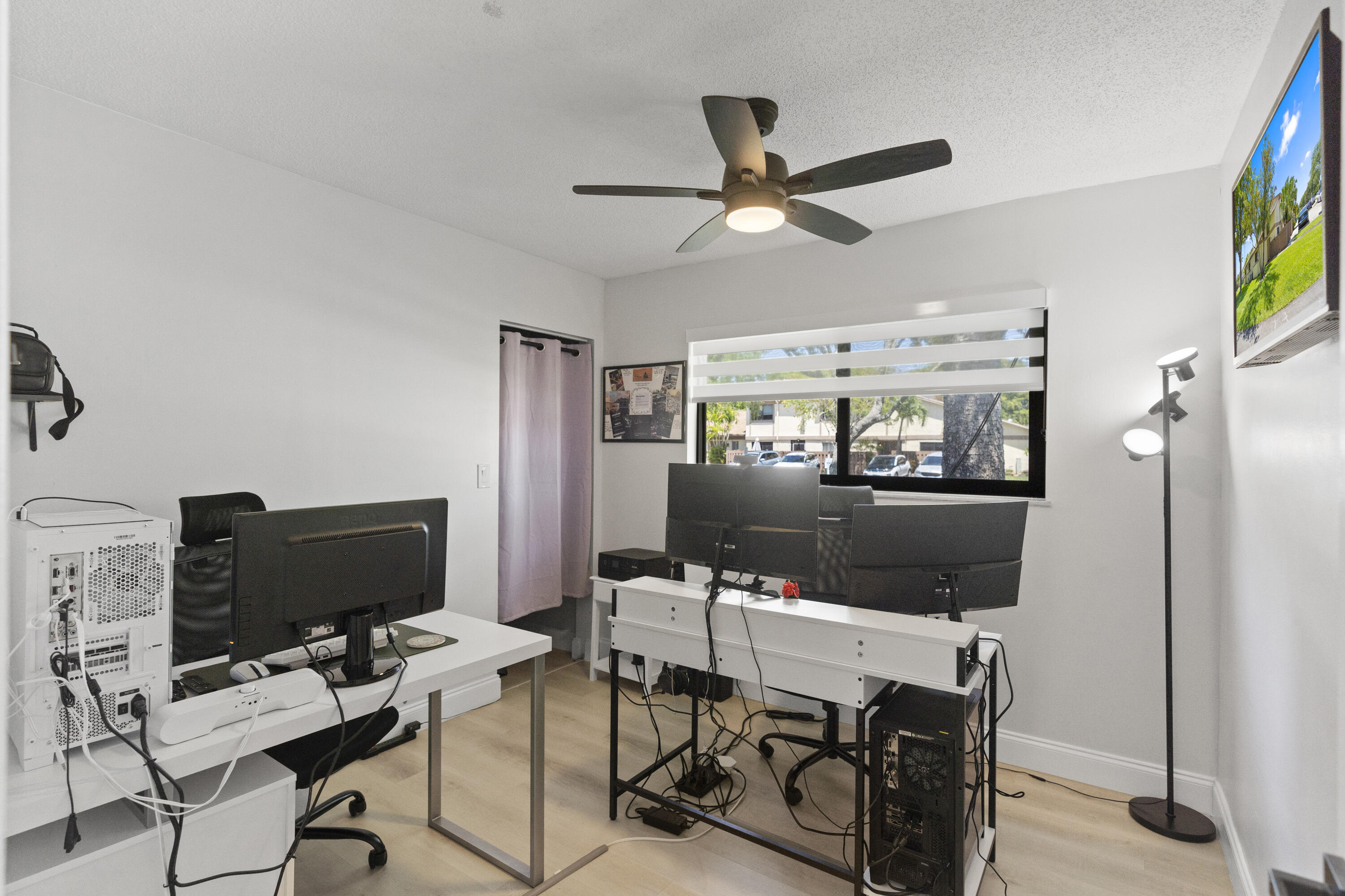 10650 Northwest 30th Place, Unit 1 Sunrise, FL 33322 - Photo 26 of 38 a workspace with furniture and a flat screen tv