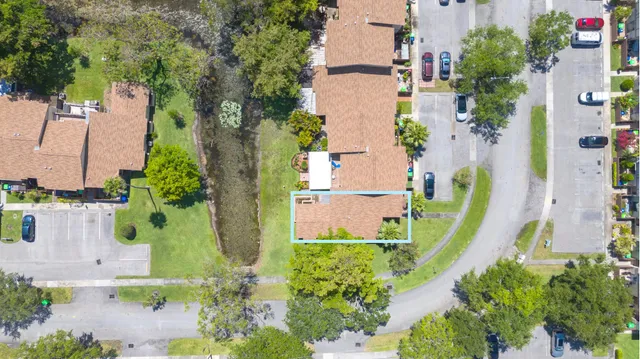 an aerial view of a house with a garden