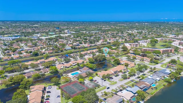 an aerial view of residential building with parking space