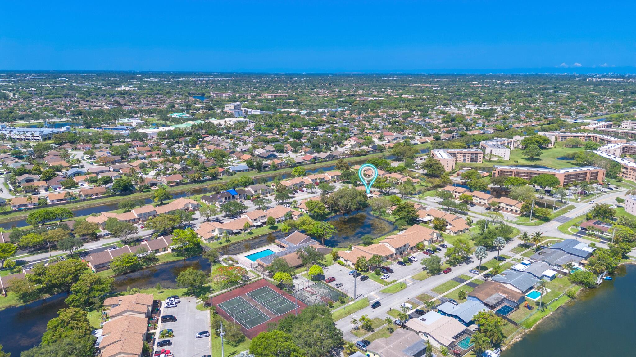 10650 Northwest 30th Place, Unit 1 Sunrise, FL 33322 - Photo 35 of 38 an aerial view of residential building with parking space