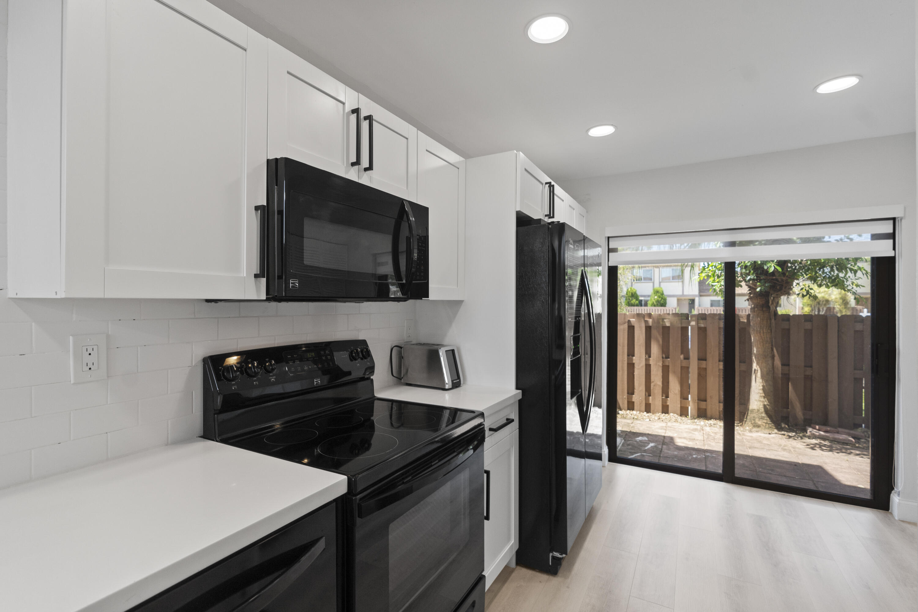 10650 Northwest 30th Place, Unit 1 Sunrise, FL 33322 - Photo 5 of 38 a kitchen with a sink and steel appliances
