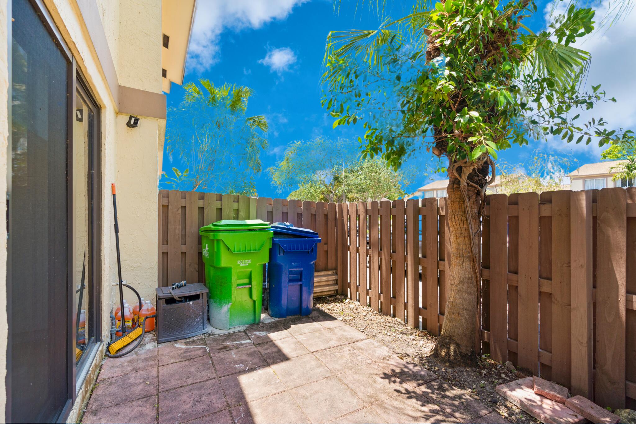 10650 Northwest 30th Place, Unit 1 Sunrise, FL 33322 - Photo 8 of 38 a view of a backyard with a trees
