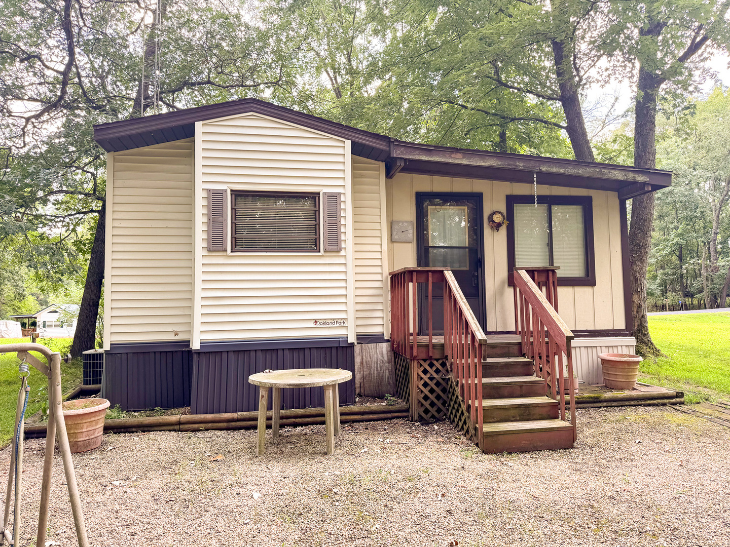 21-102 Woodhaven Sublette, IL 61367 - Photo 3 of 19 a view of house with a deck and furniture