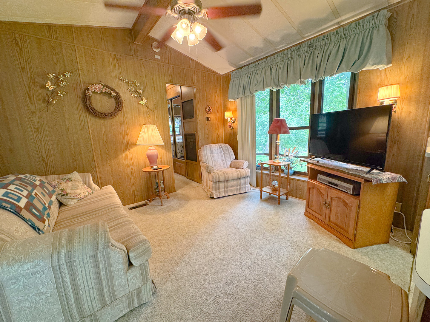 21-102 Woodhaven Sublette, IL 61367 - Photo 9 of 19 a bedroom with furniture and a flat screen tv