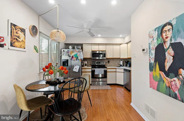 a view of a dining room with furniture and wooden floor