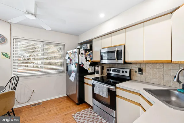 a kitchen that has a sink and a stove