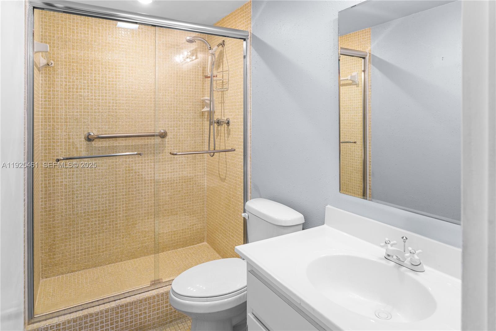 6751 Cypress Road, Unit 207 Plantation, FL 33317 - Photo 11 of 20 a bathroom with a sink and a mirror