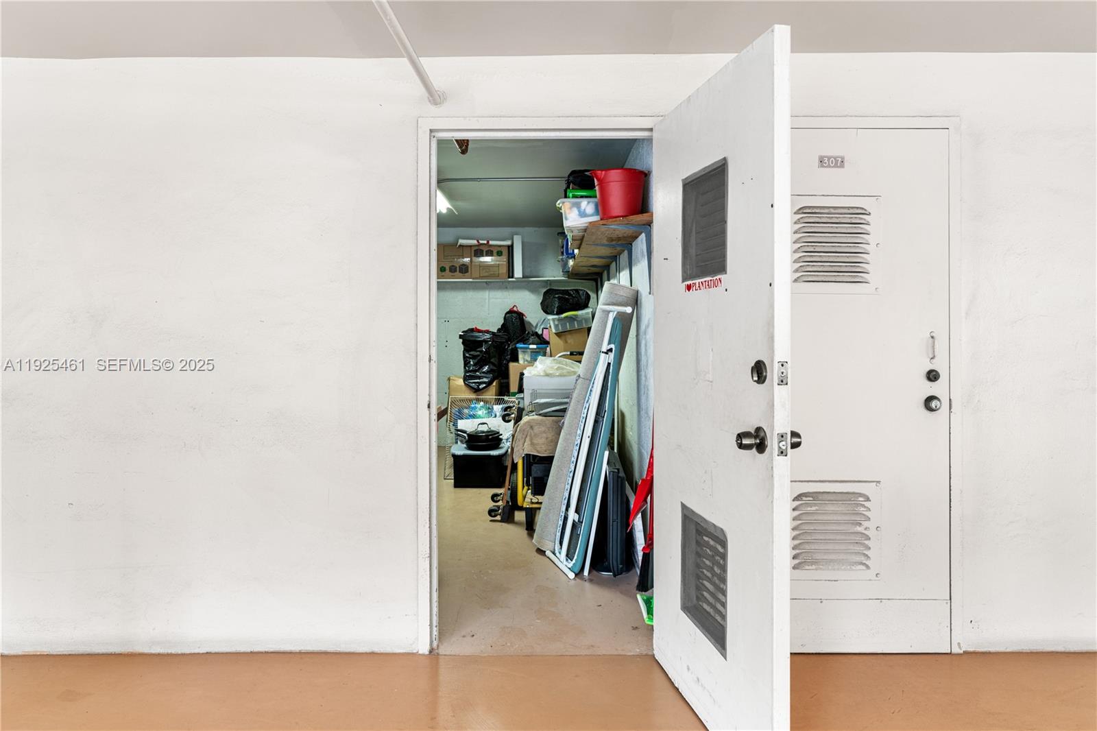 6751 Cypress Road, Unit 207 Plantation, FL 33317 - Photo 17 of 20 a view of a hallway with closet and a window
