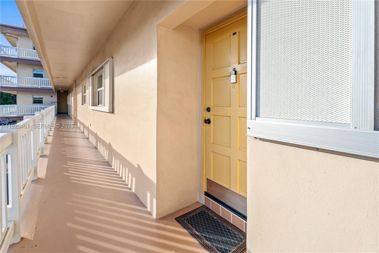 6751 Cypress Road, Unit 207 Plantation, FL 33317 - Photo 18 of 20 a view of a hallway with wooden floor and staircase