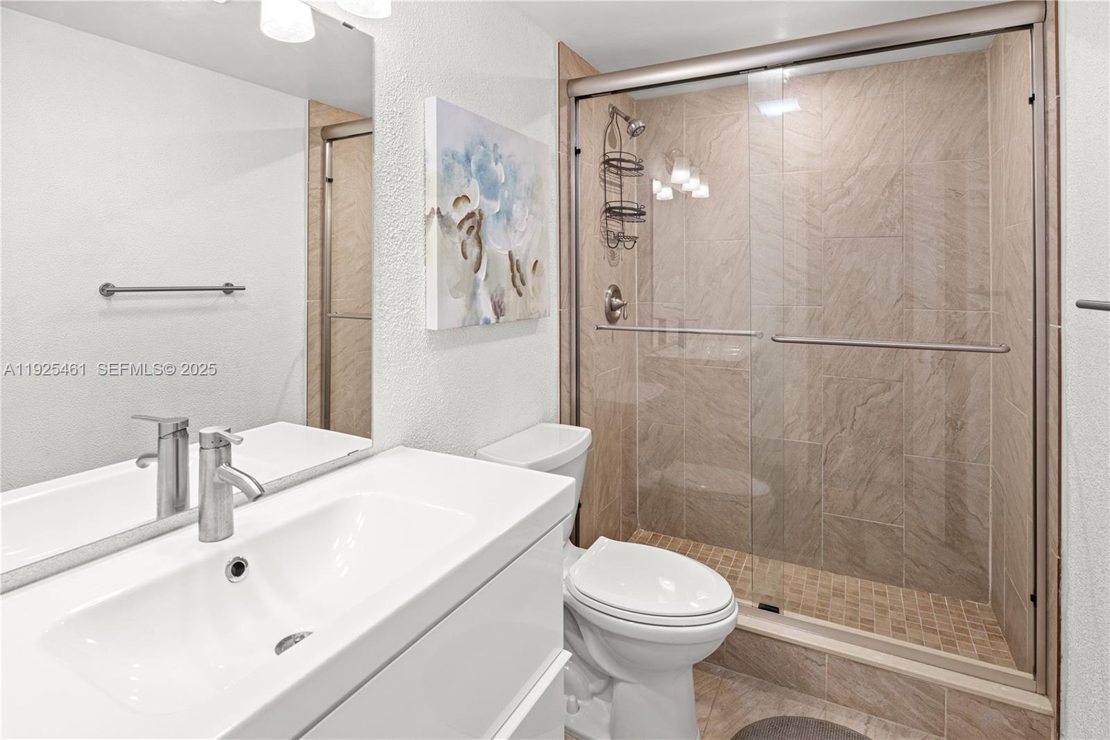 6751 Cypress Road, Unit 207 Plantation, FL 33317 - Photo 5 of 20 a bathroom with a sink and a mirror