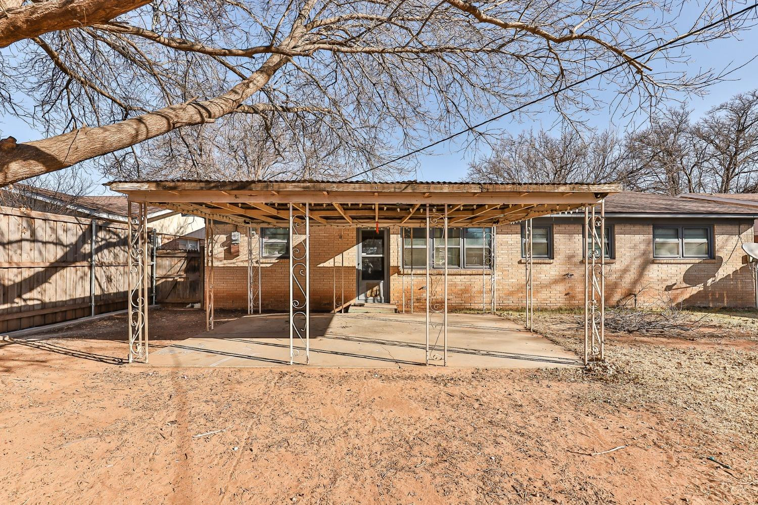 3621 56th Street Lubbock, TX 79413 - Photo 30 of 32 a backyard of a house with basket ball court