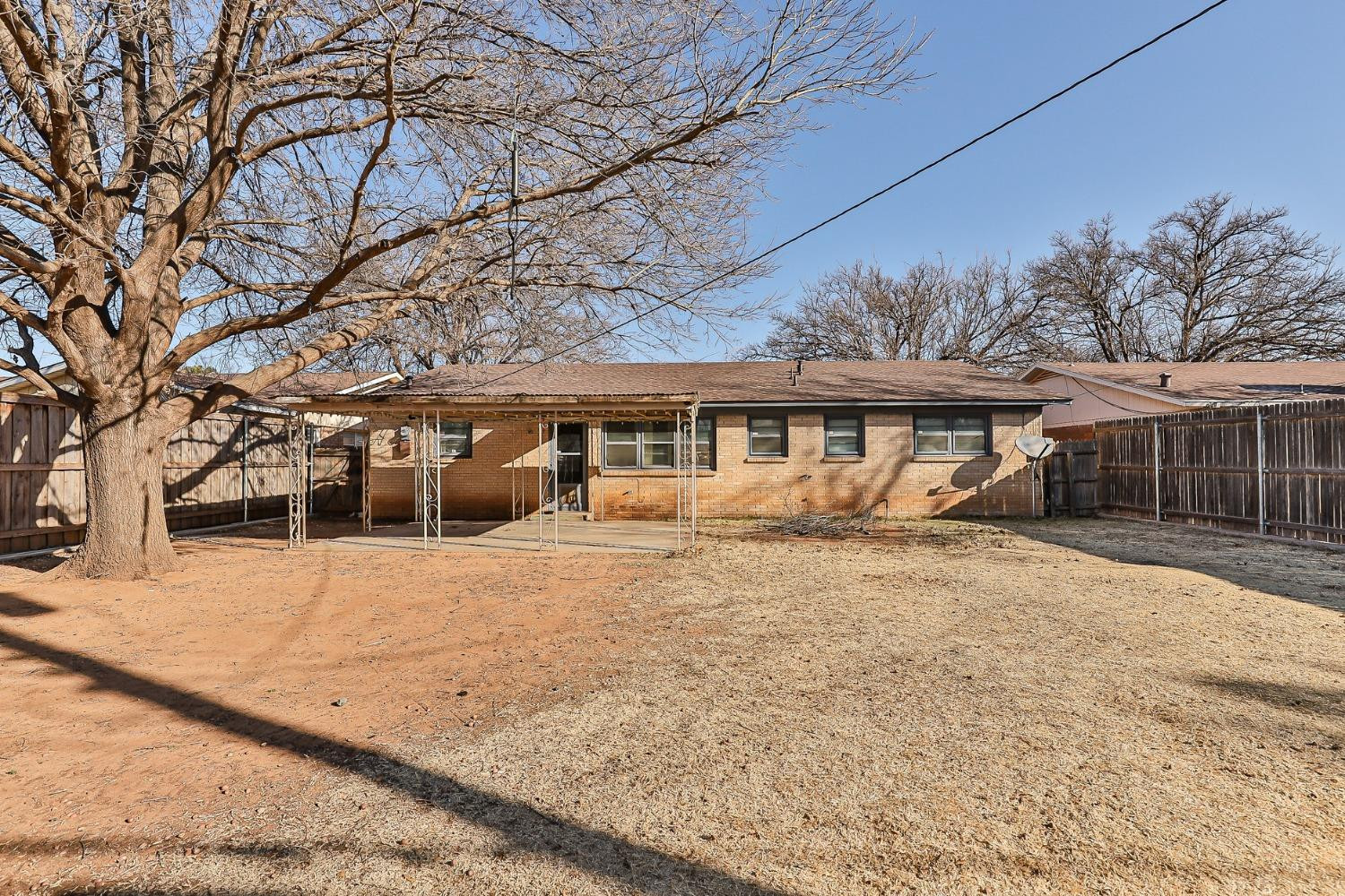 3621 56th Street Lubbock, TX 79413 - Photo 31 of 32 front view of a house with a yard