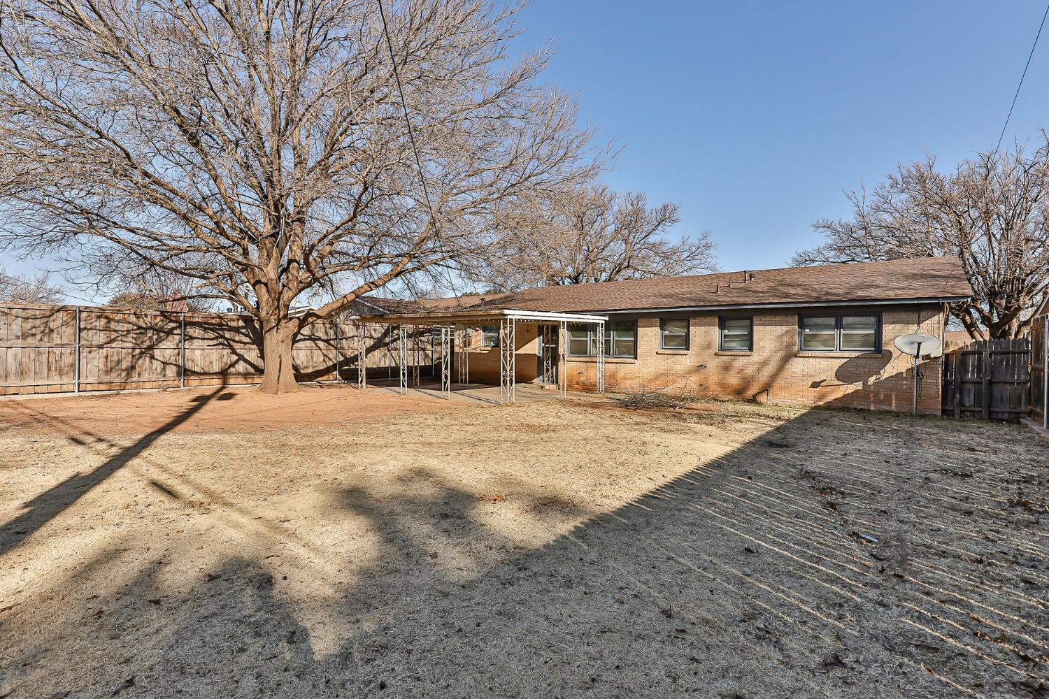 3621 56th Street Lubbock, TX 79413 - Photo 32 of 32 a front view of a house with a yard