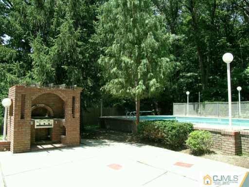 21 Navajo Road East Brunswick, NJ 08816 - Photo 2 of 8 a front view of a house with a yard