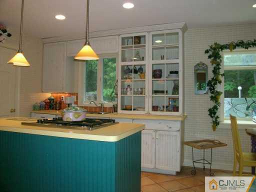 21 Navajo Road East Brunswick, NJ 08816 - Photo 4 of 8 a kitchen with a stove a sink and a cabinets