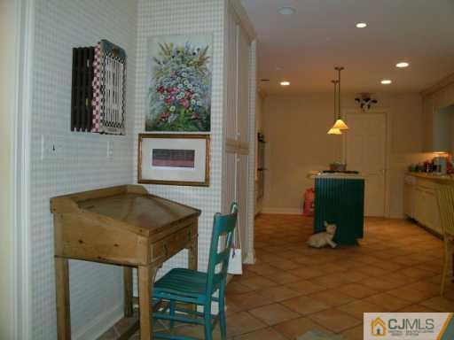 21 Navajo Road East Brunswick, NJ 08816 - Photo 5 of 8 a bathroom with a sink a toilet and mirror