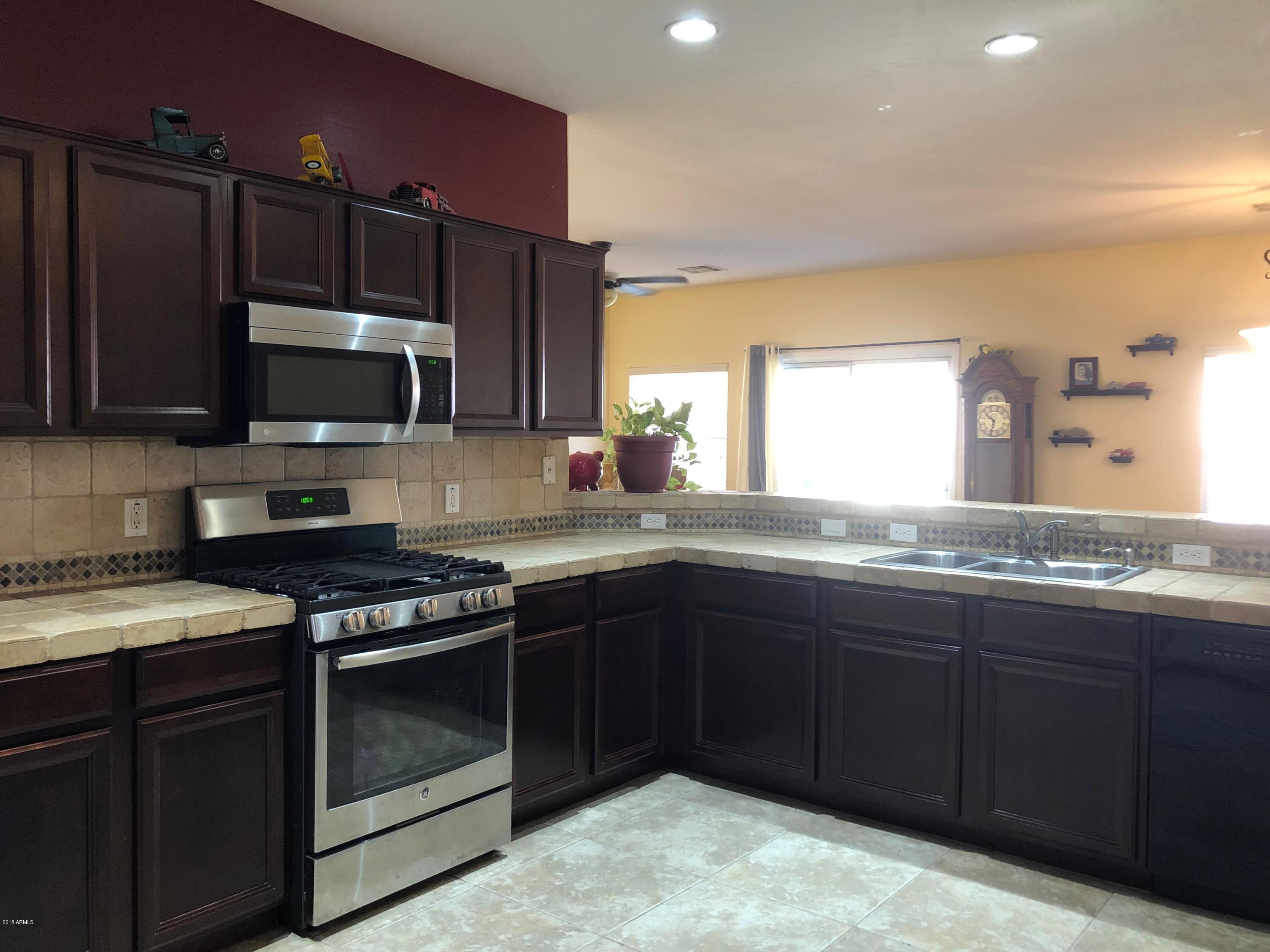 15832 West Calavar Road Surprise, AZ 85379 - Photo 2 of 58 KITCHEN W/CHERRY CABINETS