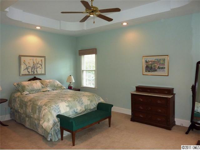 331 Gringley Hill Road Fort Mill, SC 29708 - Photo 8 of 16 a bedroom with a bed and a window