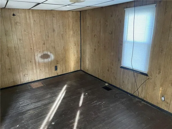 a view of a room with wooden walls